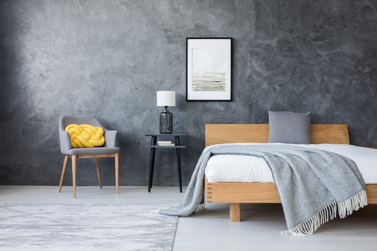 Peaceful bedside setup showing elements that support good sleep hygiene - a book, water glass, essential oil diffuser, and soft lighting, creating the perfect environment for rest